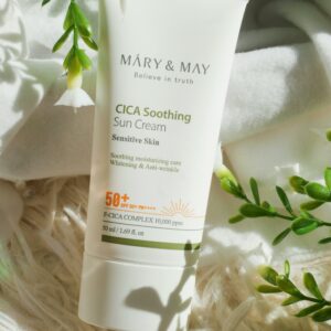 Organic sun cream amidst green foliage, perfect for sensitive skin protection.